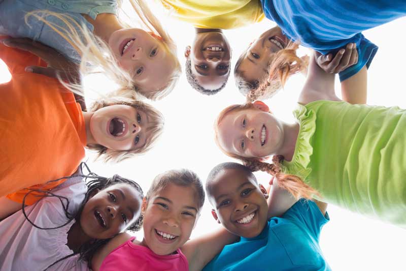 Happy Kids Smiling in a Circle at Sarasota County Summer Camp in Nokomis Florida Happy Kids Smiling in a Circle at Sarasota County Summer Camp in Nokomis Florida